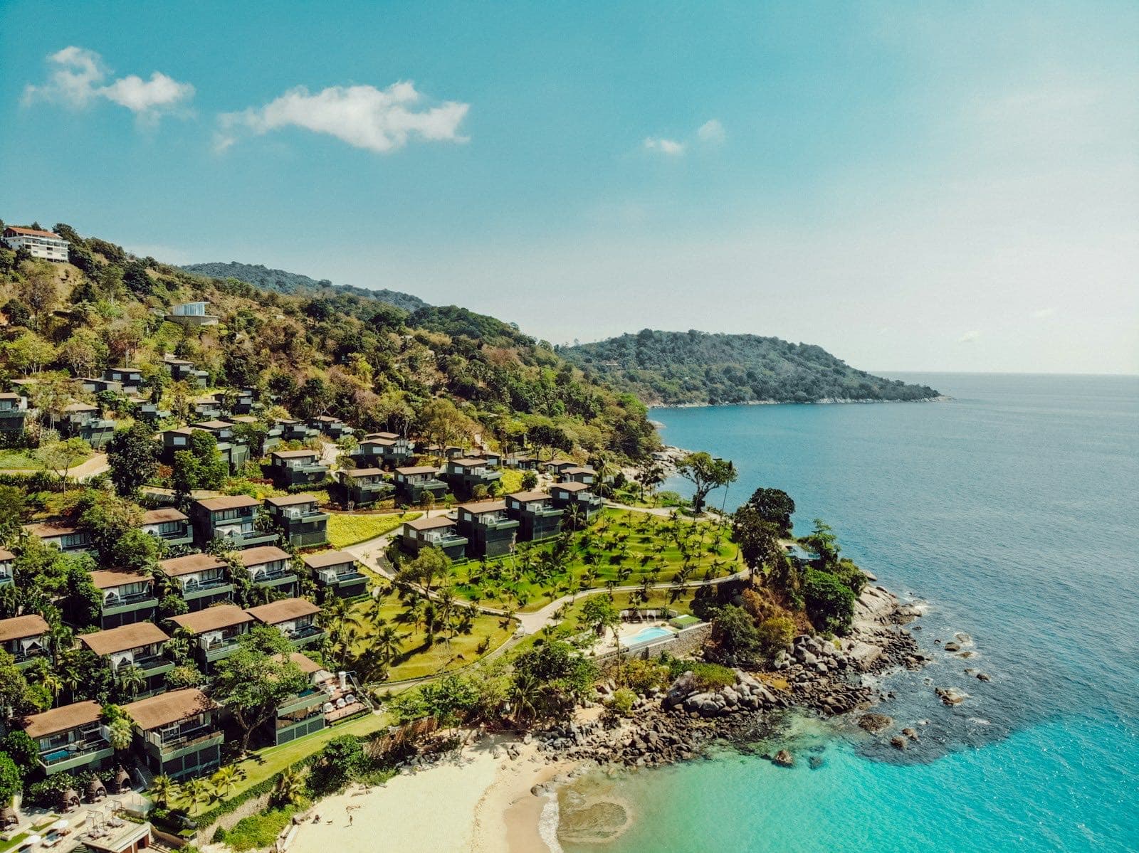 Hillside villas overlooking turquoise water at Kata Noi, Phuket